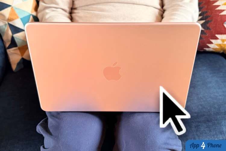 MacBook rose avec curseur de souris visible
