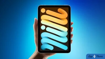 iPad mini tenu verticalement avec écran aux formes colorées