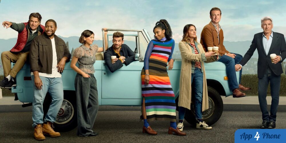 Distribution de la série Shrinking posant devant une voiture ancienne