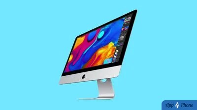 Vue inclinée d’un iMac argenté sur son pied
