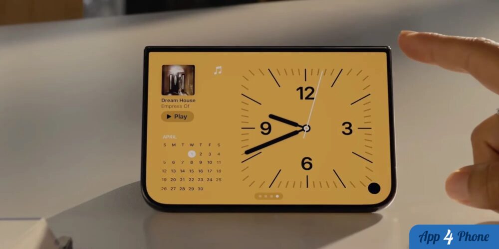 iPhone posé en mode StandBy affichant une horloge et un calendrier
