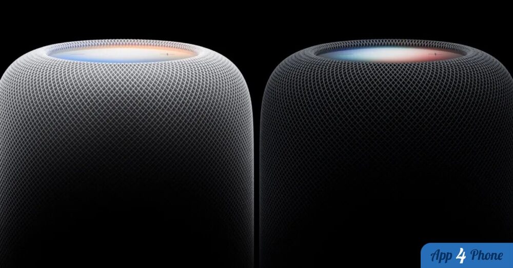 Deux HomePod, blanc et noir, photographiés sur fond noir