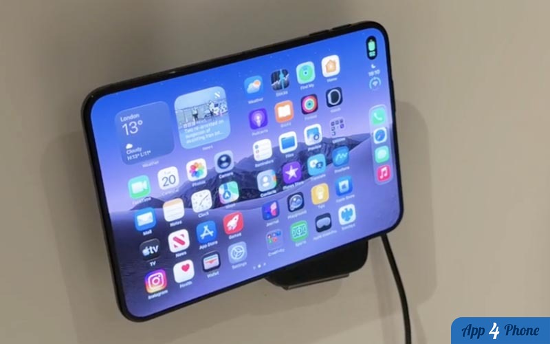 Smartphone posé sur un support vertical avec câble de recharge