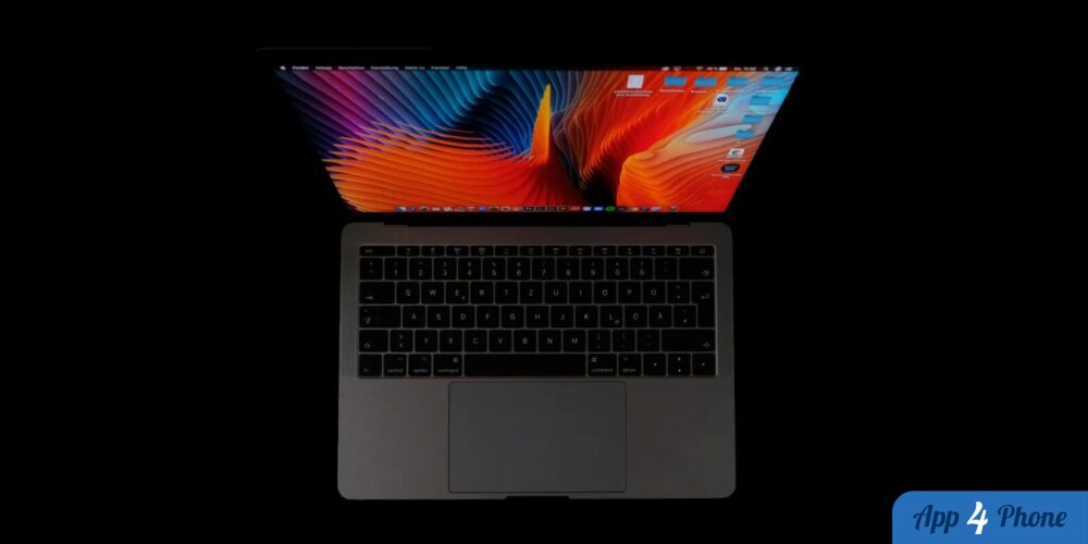 MacBook Pro ouvert affichant un fond d’écran coloré