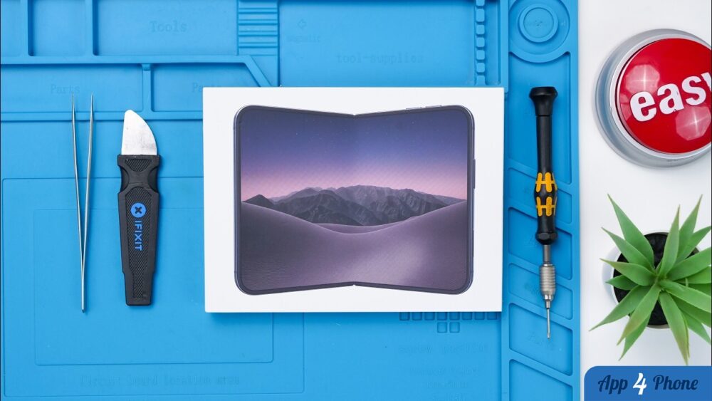 Boîte d’iPhone Duo entourée d’outils de réparation